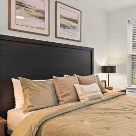 bedroom with bed and large window near Arden, NC